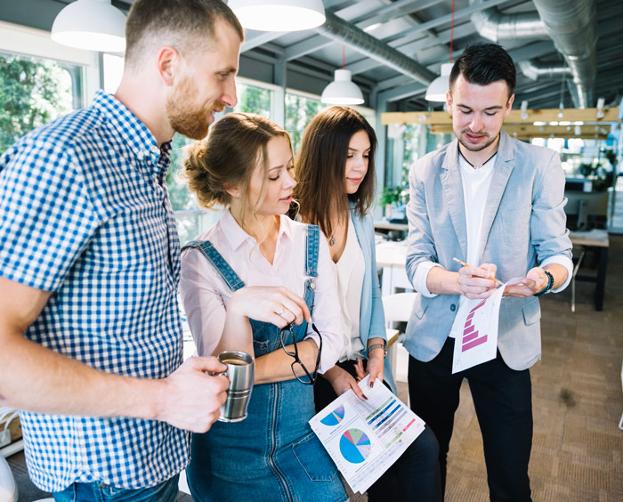 A group of merchants discussing about business revenue. 